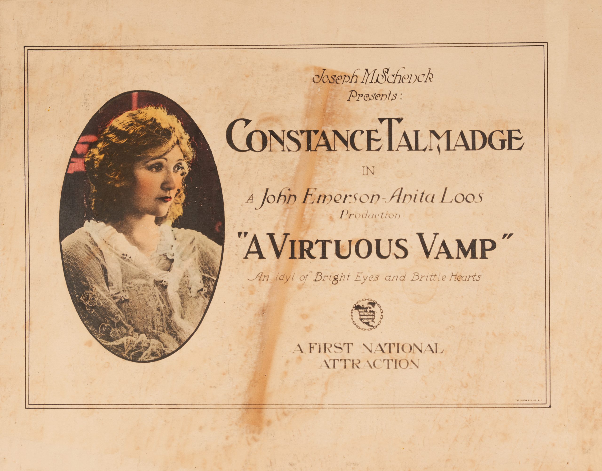 A lobby card featuring a colored-in portrait of the lead actress and details of the film.