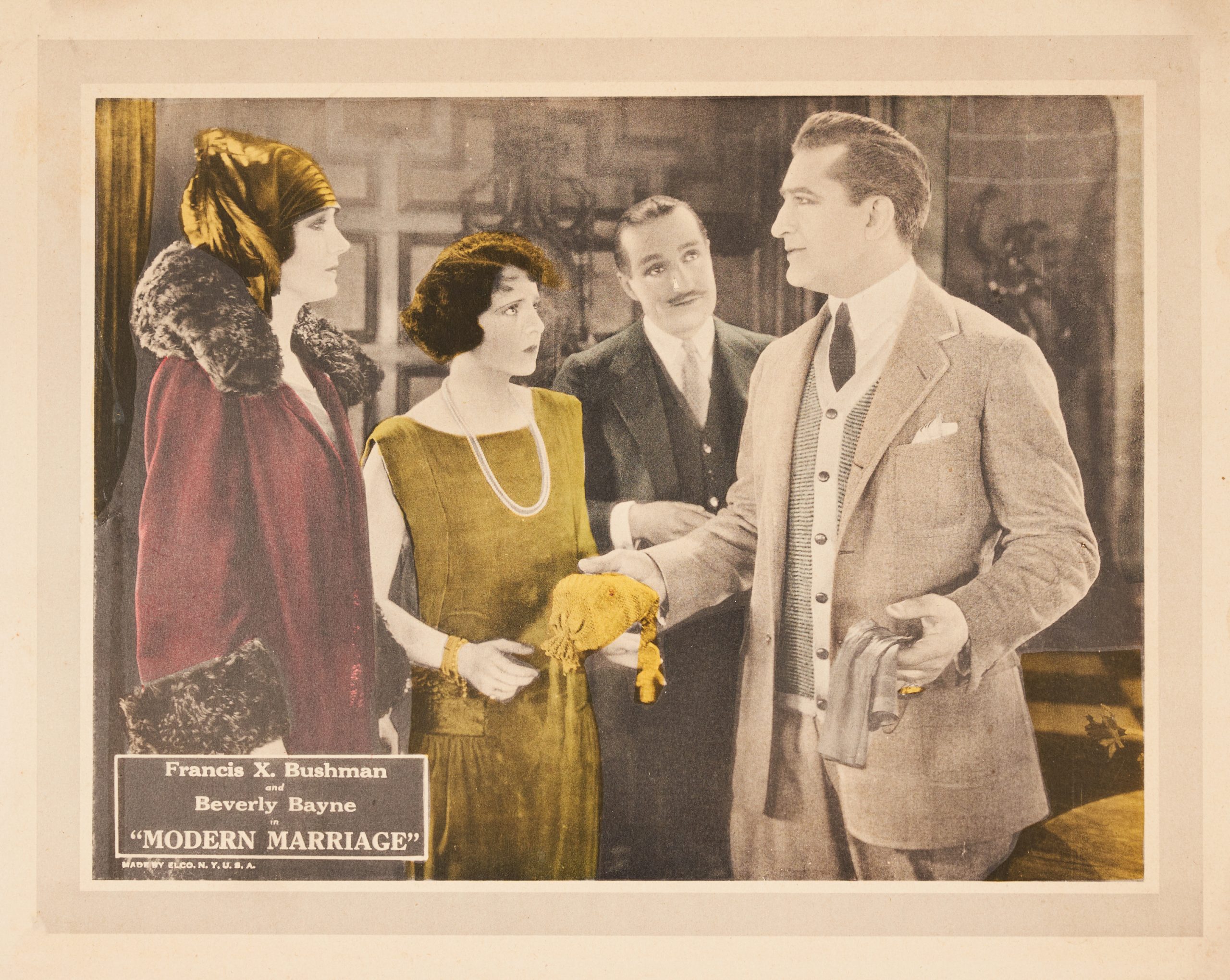 Partially colored-in lobby card with two women and two men. Man on the right holds out a yellow bag.