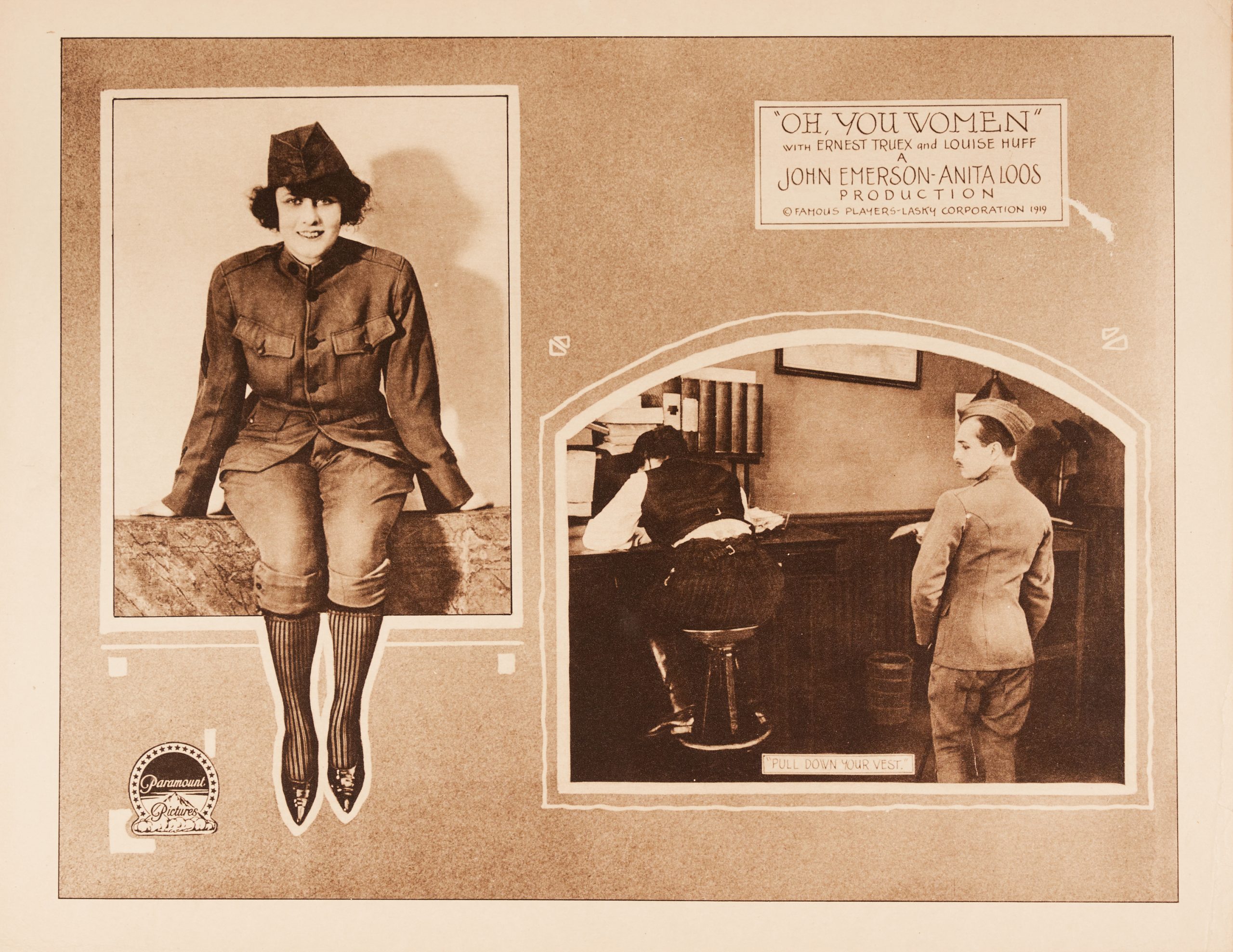 A lobby card featuring two vignettes of the female characters wearing men's clothes.