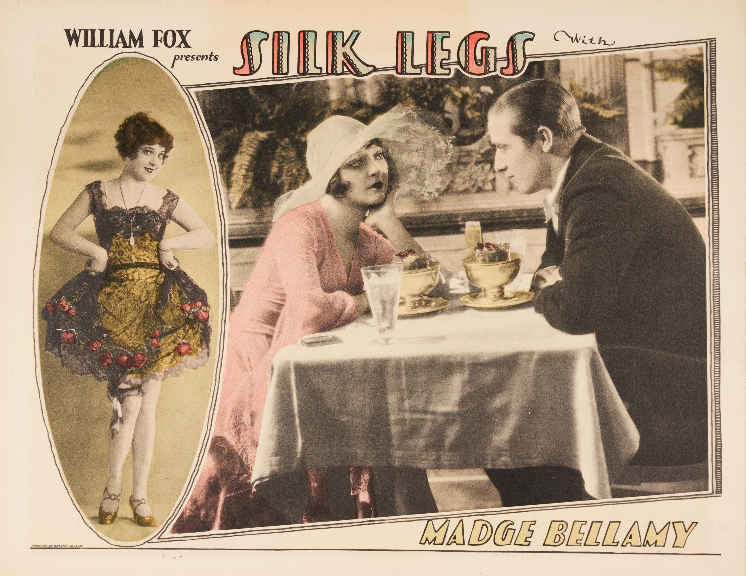 A lobby card with a man and woman sitting across one another and an oval fashion photo on the left.