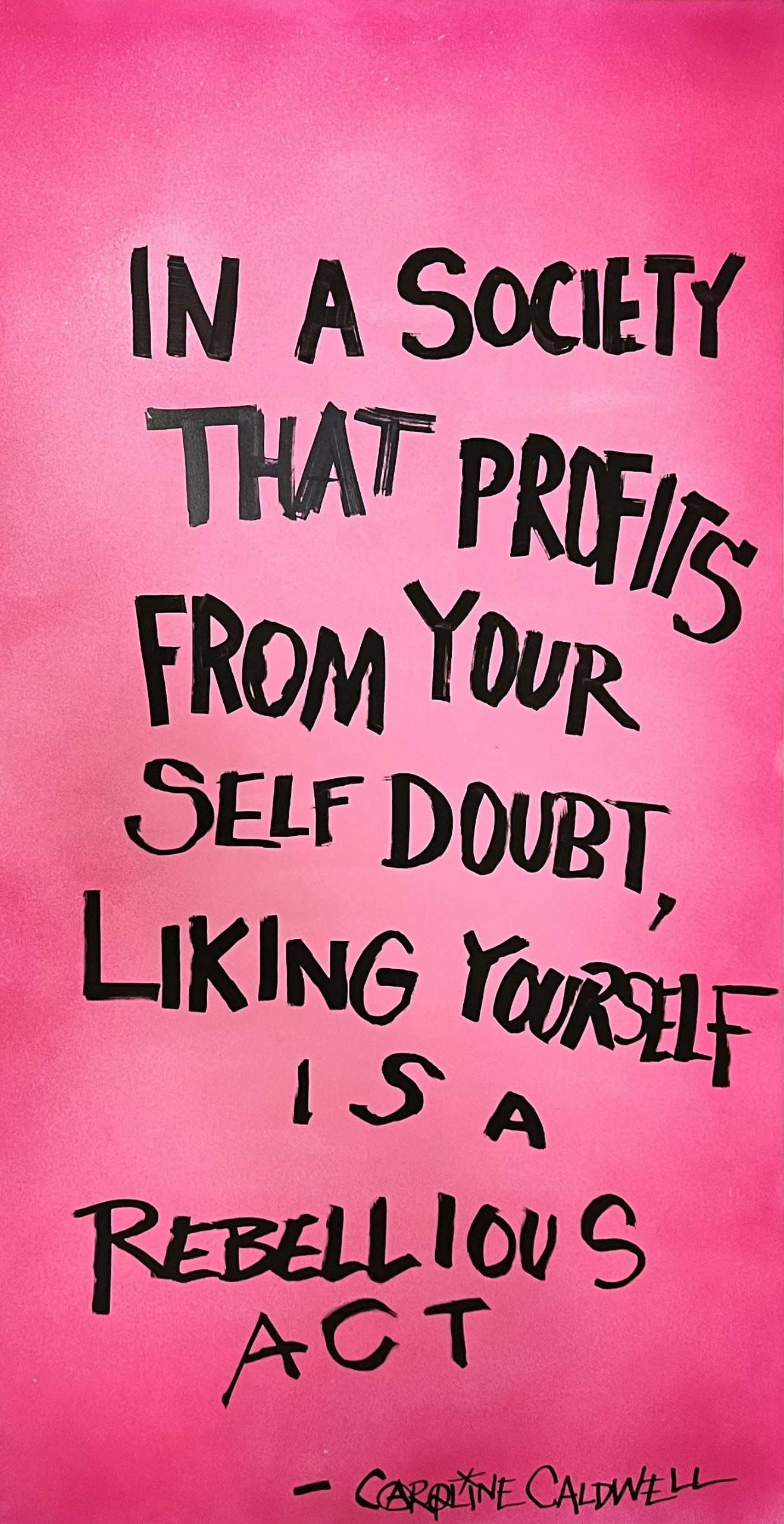 A spray painted poster depicting black handwritten text on a pink background.