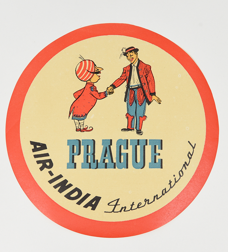 A coaster of a mustachiod figure wearing a turban shaking hands with a person from Prague.