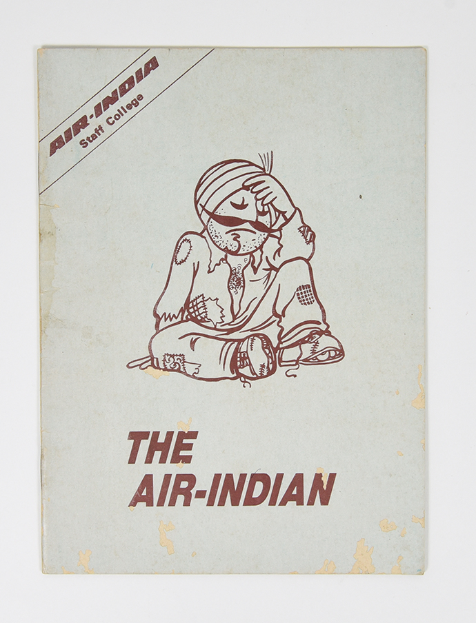 A booklet depicting a mustachioed figure with ripped up clothes sitting on the ground, defeated.